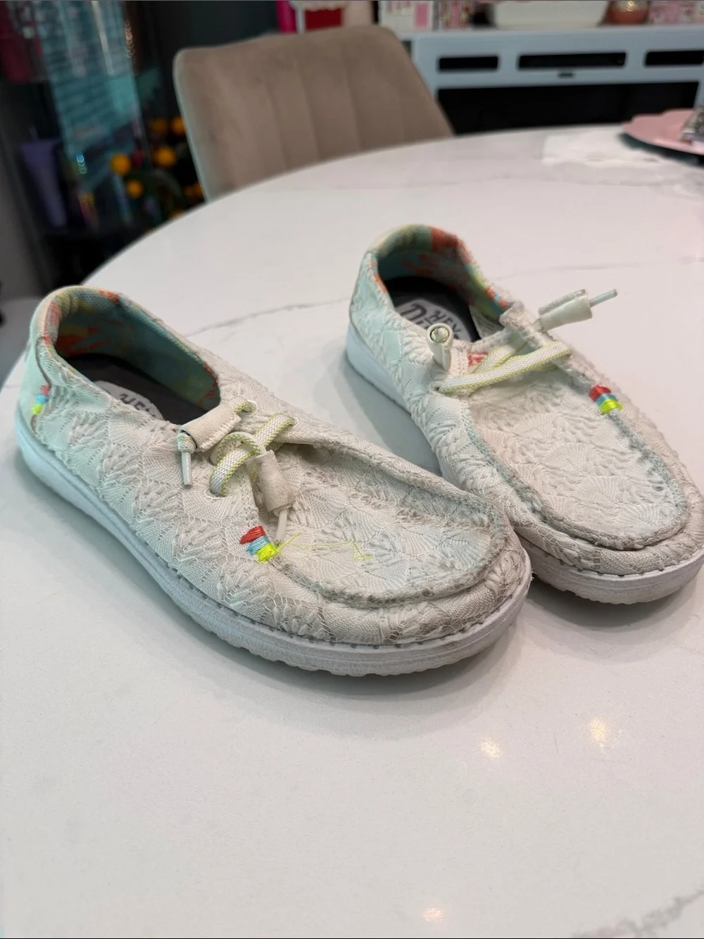 Hey Dude women’s White Slip-On Moccasins with Pastel Rainbow Details